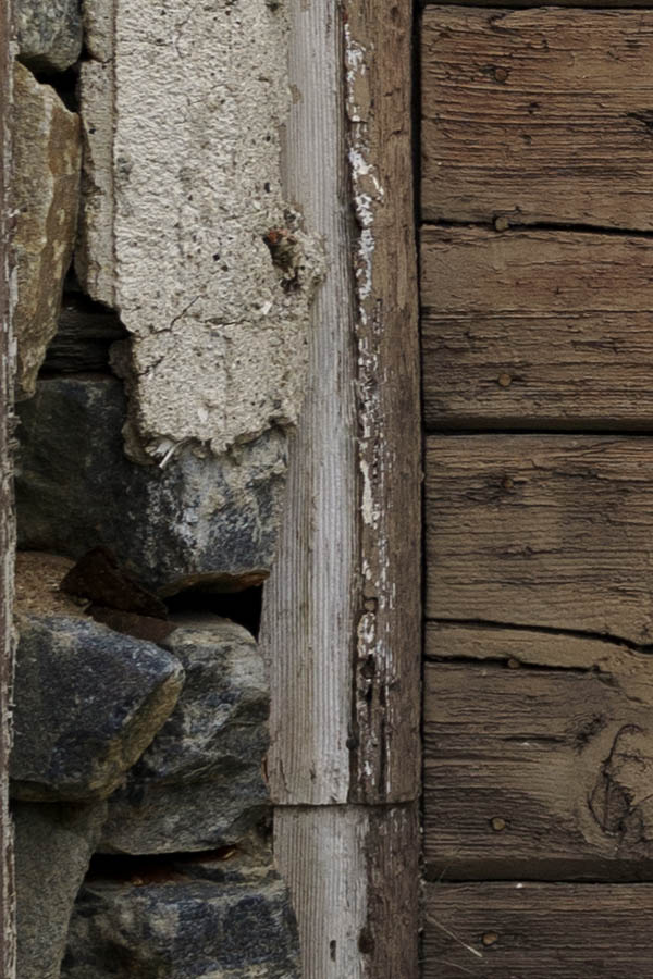 Photo 26698: Worn, narrow, brown double door of boards
