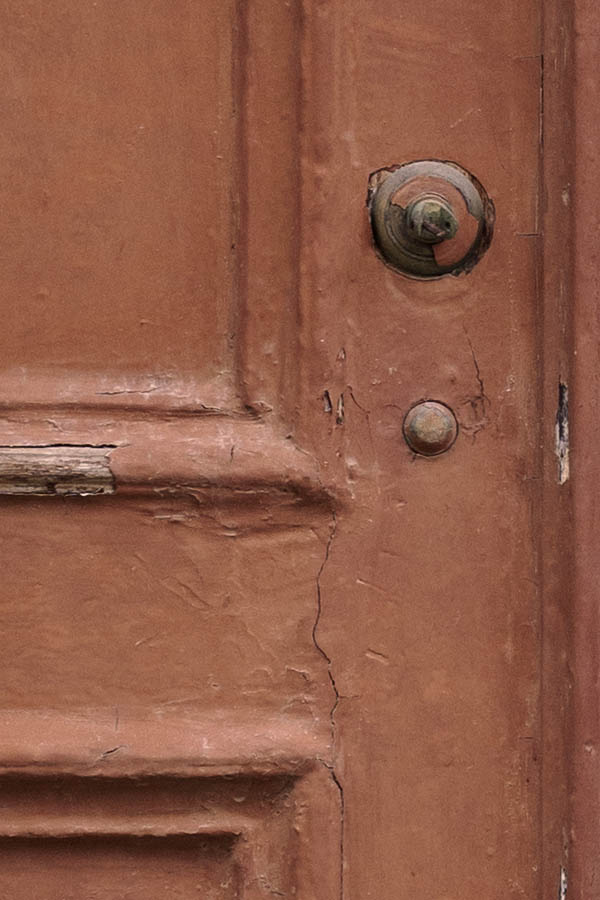 Photo 26731: Worn, brown, panelled double door with green top window