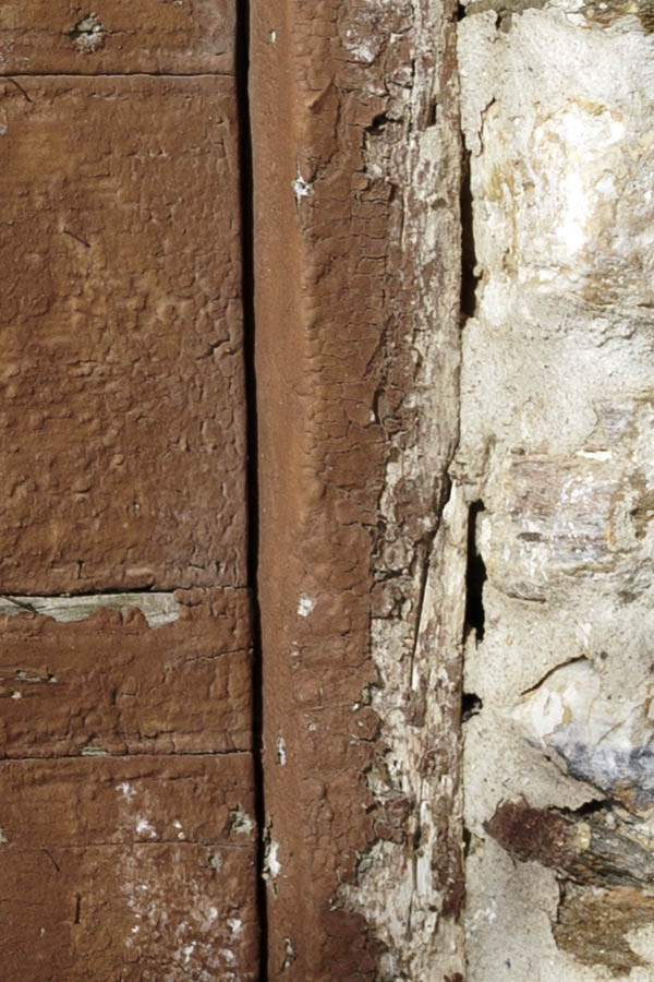 Photo 26777: Worn, narrow, brown double door of boards
