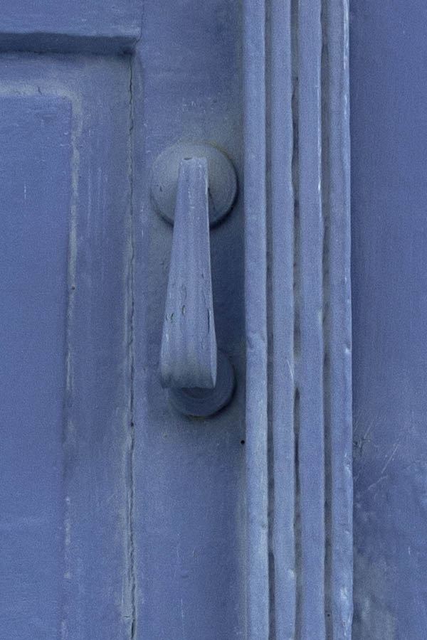 Photo 26867: Worn, panelled, light blue double door in a white frame