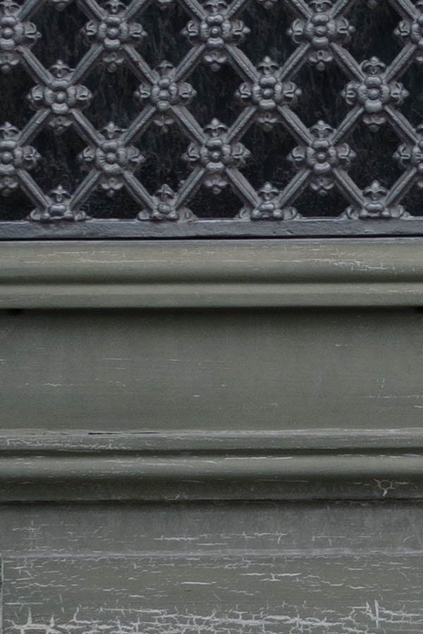 Photo 27172: Worn, green, panelled double door with grey, latticed windows 