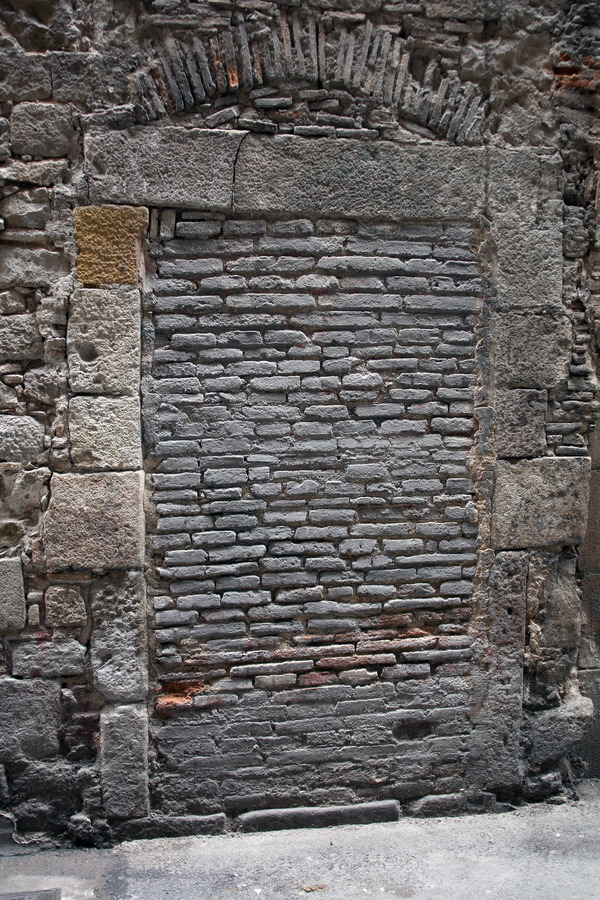 Photo 02370: Decayed, former door with black bricks