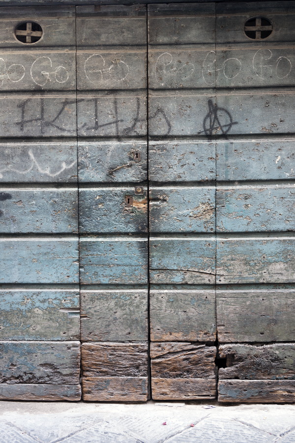 Photo 14895: Worn, brown and blue door of planks