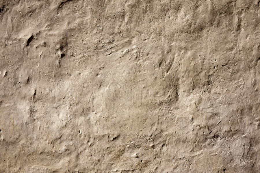 Photo 19960: Plastered, brown wall.