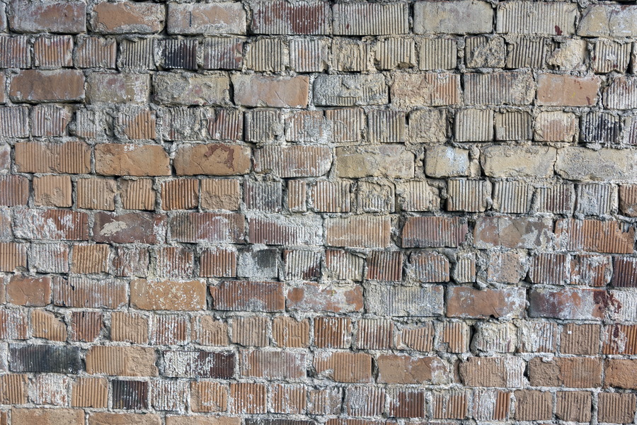 Photo 20090: Worn wall of yellow and red bricks