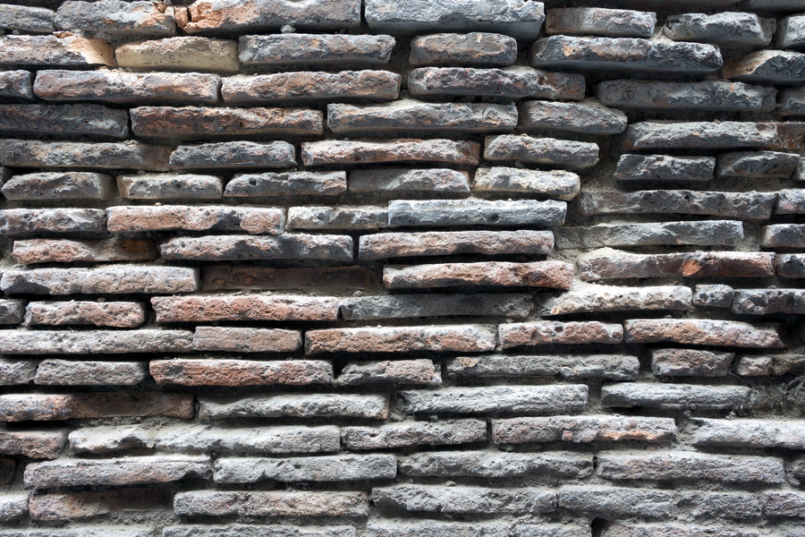 Photo 23898: Decayed brick wall with flat, red and black bricks