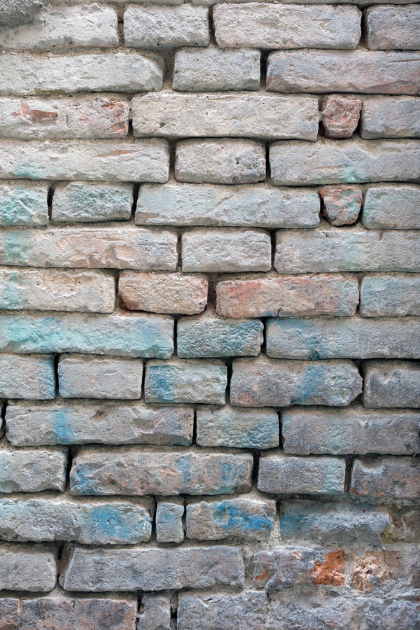 Photo 23933: Decayed brick wall with bricks in white, red and turquoise