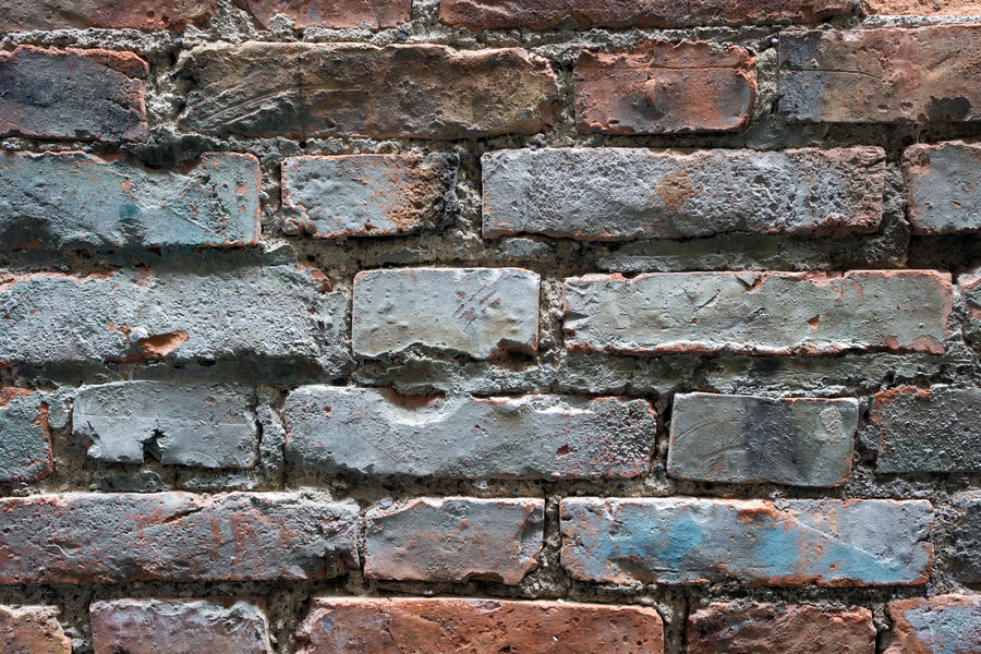 Photo 23934: Worn brick wall with blue and red colours