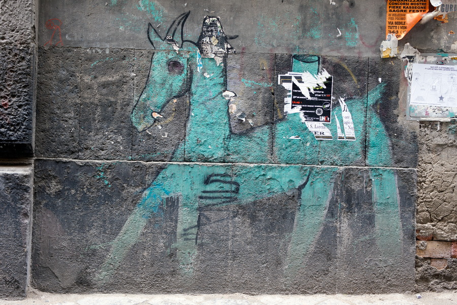 Photo 23940: Indented, grey stone wall with a green horse grafitti