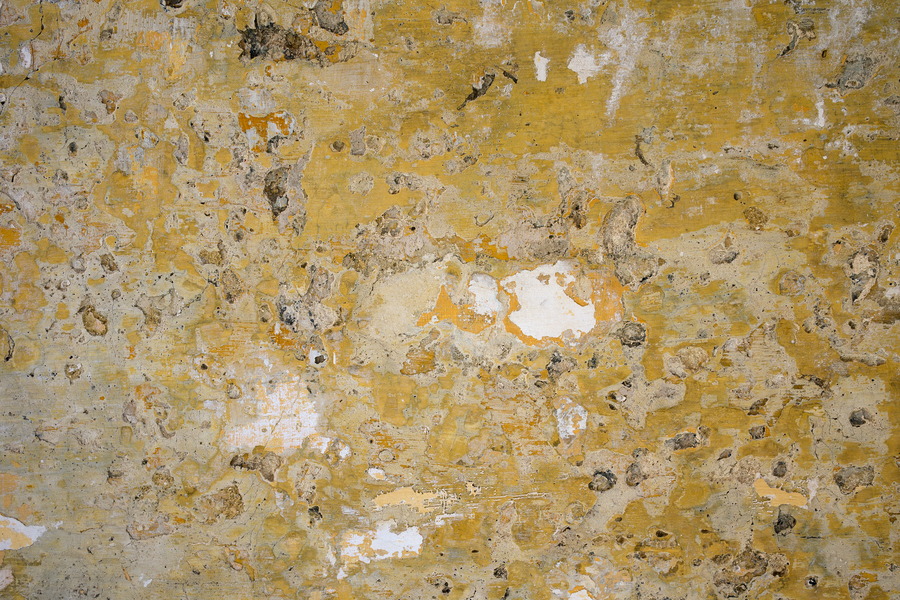 Photo 24256: Worn, plastered wall in yellow and white colours