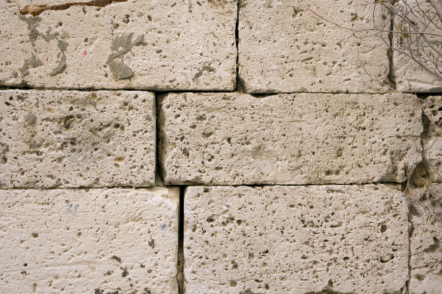 Photo 24417: Worn, yellow sandstone wall without mortar