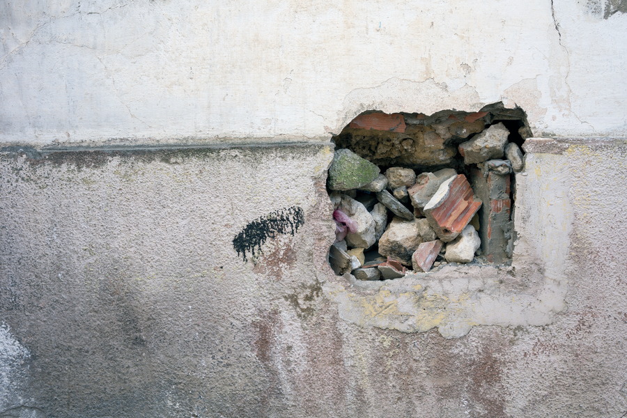 Photo 24585: Decayed, plastered, grey and white wall with a hole