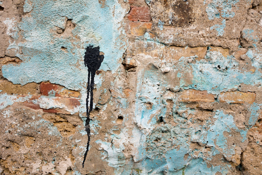 Photo 24614: Decayed, plastered brick wall in light blue, light brown and black