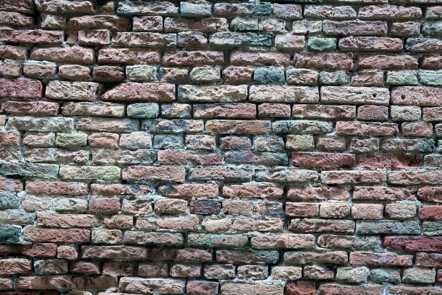 Photo 24788: Decayed brick wall in red, yellow and blue colours