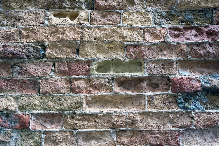 Photo 24789: Decayed brick wall in red, yellow and blue colours.