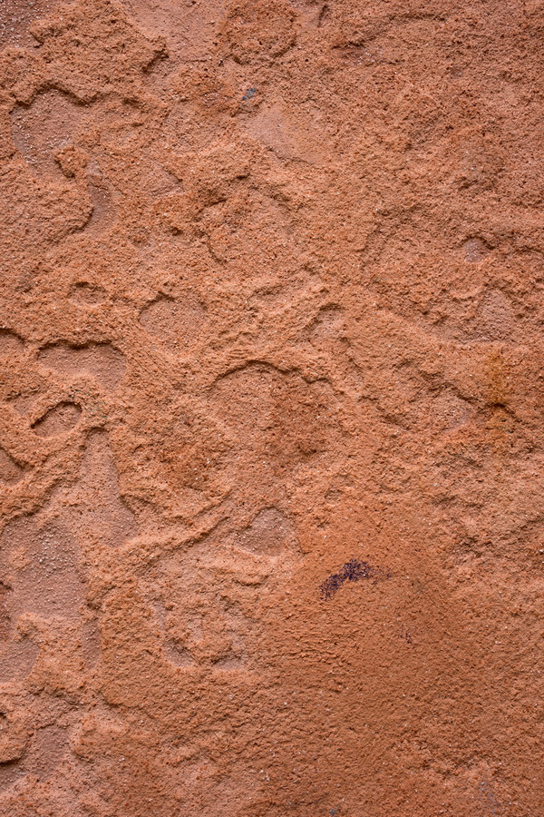 Photo 24810: Red plastered wall with uneven pattern