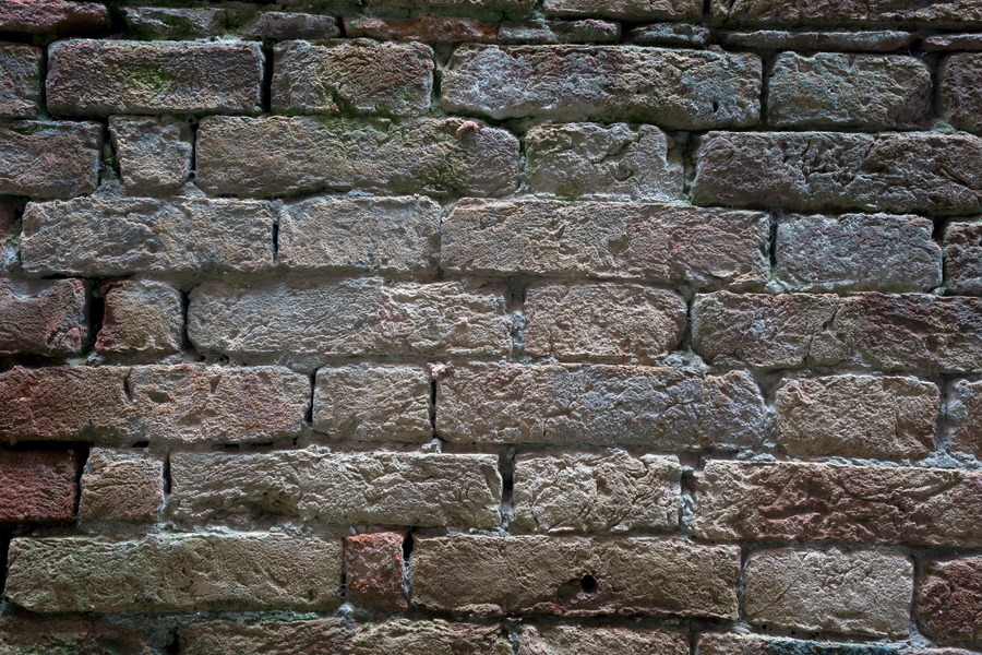 Photo 24817: Worn brick wall in white, red, blue and green