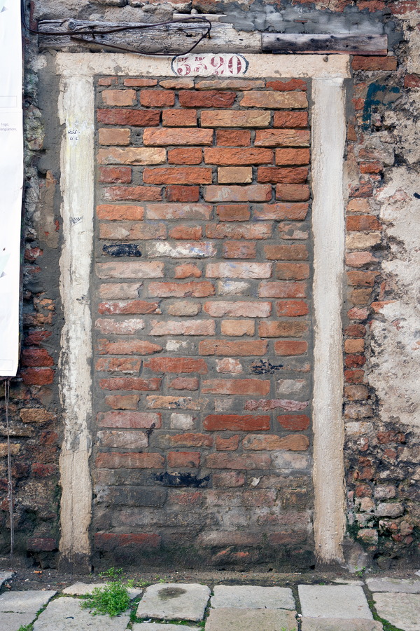 Photo 24871: Worn, red and white brick wall with remains of a doorway