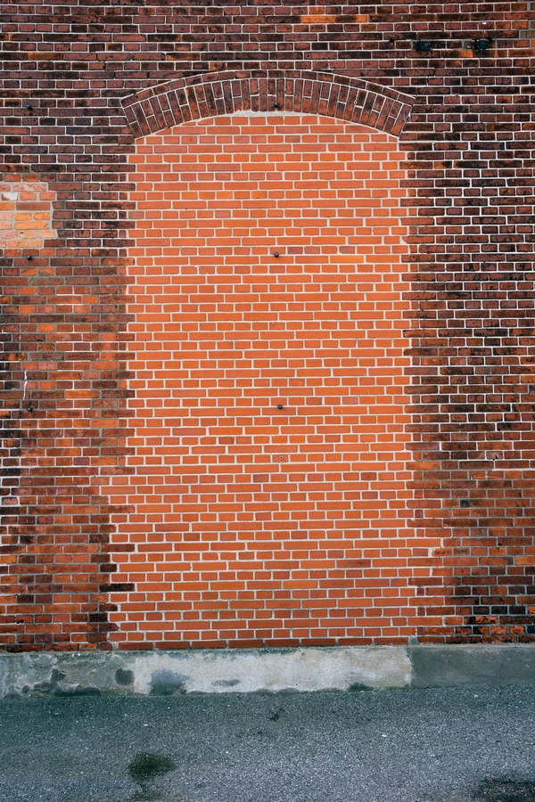 Photo 25093: Red brick wall with remains of a doorway.