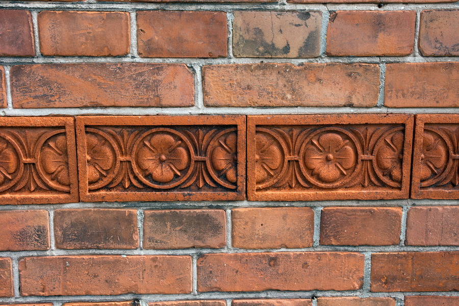 Photo 25095: Red brick wall with a red frieze.