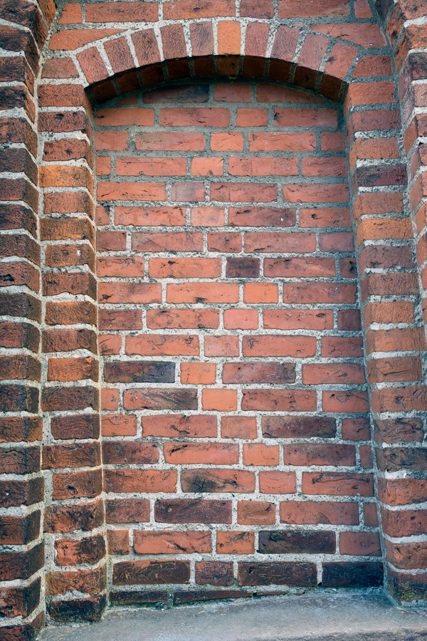 Photo 25312: Lopsided, red brick wall with indentation