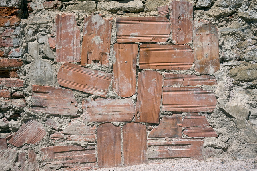 Photo 25469: Decayed stone wall repaired with red tiles