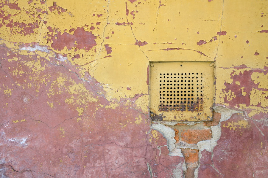 Photo 25728: Decayed, plastered brick wall in yellow and light red with a hatch