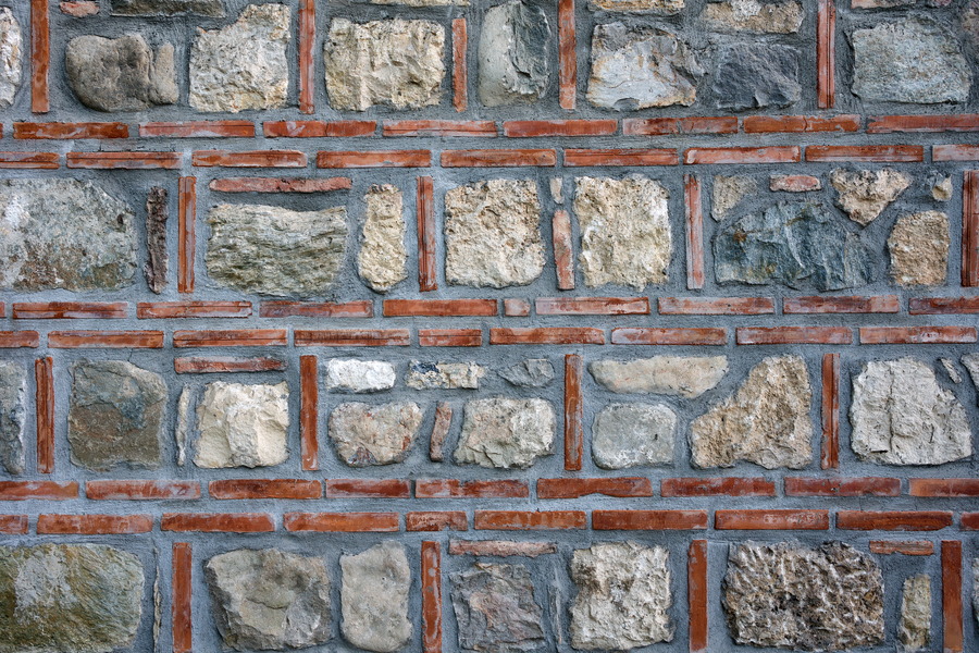 Photo 26358: Wall with stones and red tiles. Well maintained.