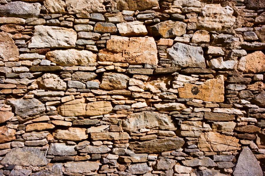 Photo 27408: Yellow stone wall with small and large stones