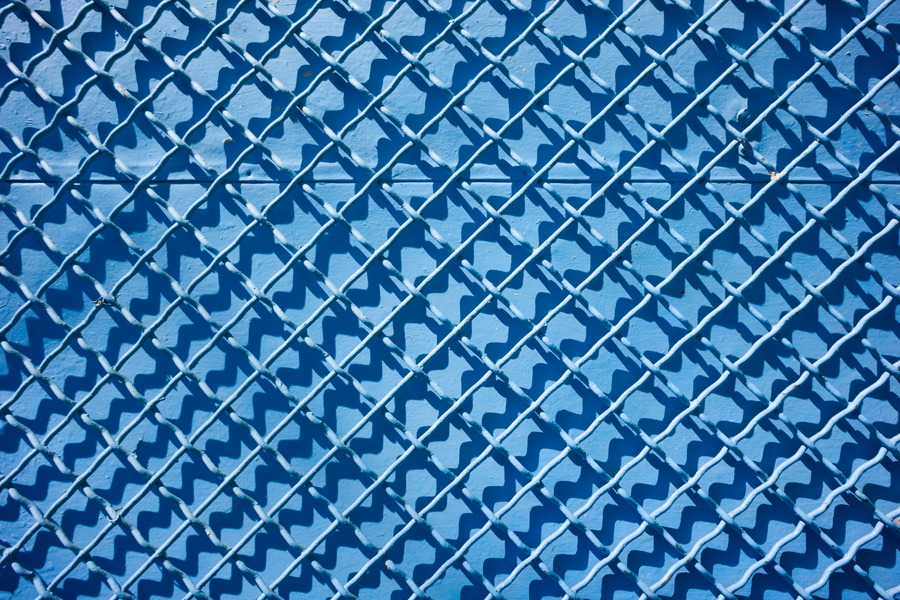 Photo 27409: Blue metal wall with blue grating. Well maintained.