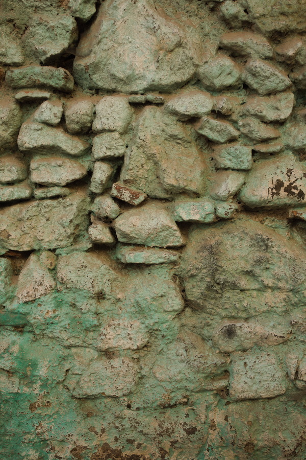 Photo 27424: Worn, green and light brown stone wall