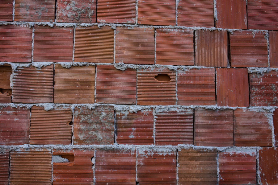 Photo 27429: Rough wall of red bricks.