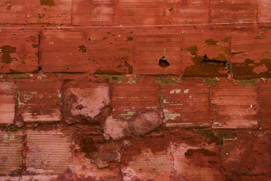 Photo 27430: Rough wall of red bricks.