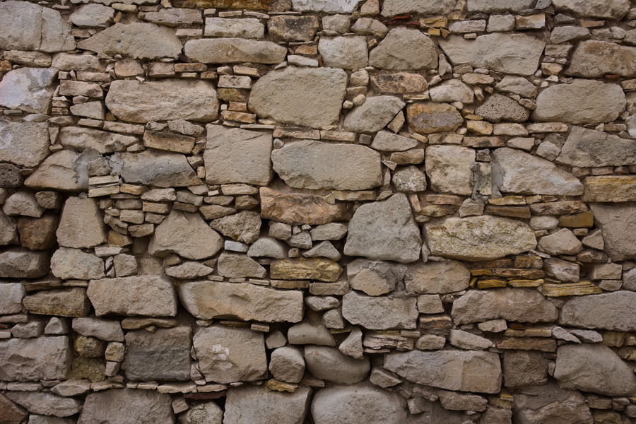 Photo 27432: Stone wall with yellow and grey stones of various sizes