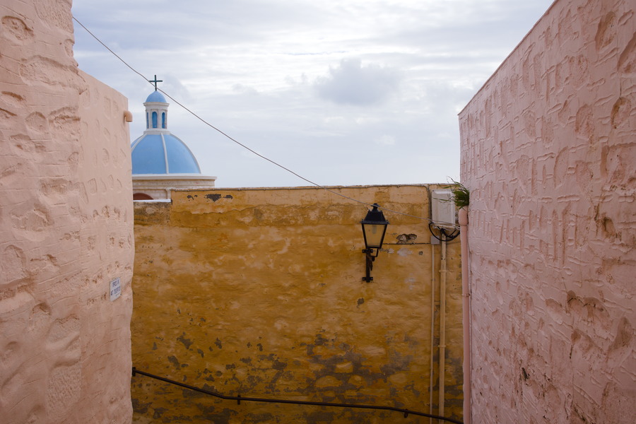 Photo 27456: Pink and yellow, plastered walls and a light blue church cupola