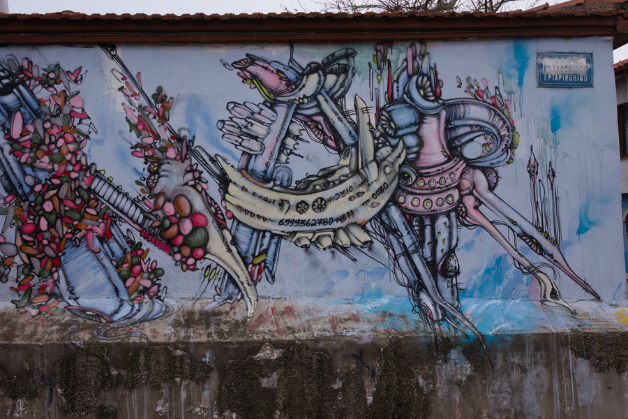 Photo 27466: Plastered, light blue wall with large grafitti
