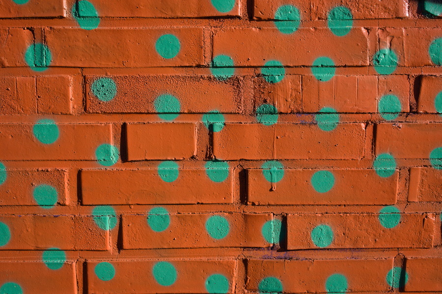 Photo 27483: Brick wall with grafitti: Green dots on orange background