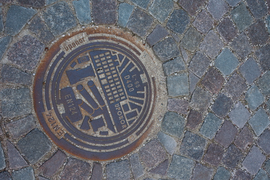 Photo 27494: Grey pavement with well cover