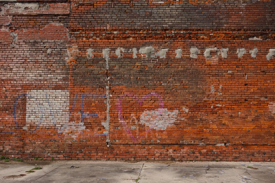 Photo 27516: Worn, red brick wall