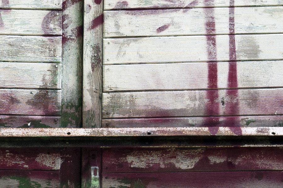 Photo 13332: Worn green double door of boards with large grafitti drawing