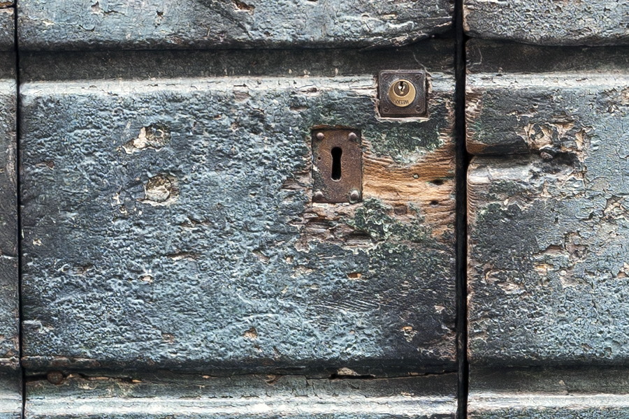 Photo 14895: Worn, brown and blue door of planks