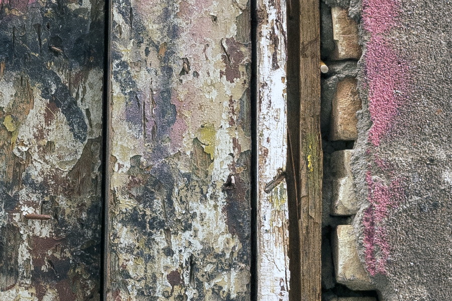 Photo 19510: Decayed, light green door of planks with grafitti