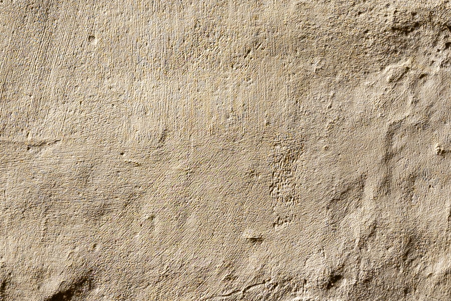 Photo 19960: Plastered, brown wall.