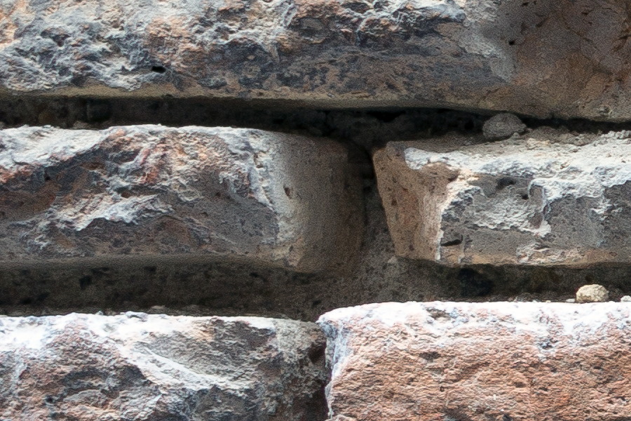 Photo 23898: Decayed brick wall with flat, red and black bricks