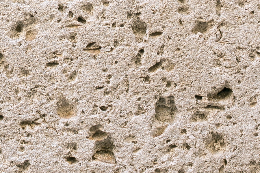 Photo 24417: Worn, yellow sandstone wall without mortar