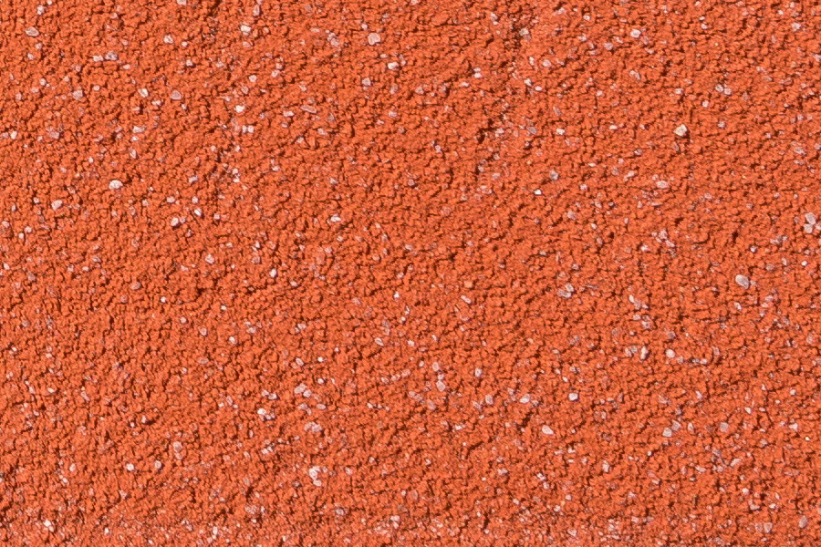 Photo 24442: Worn, red, plastered wall with traces of grafitti