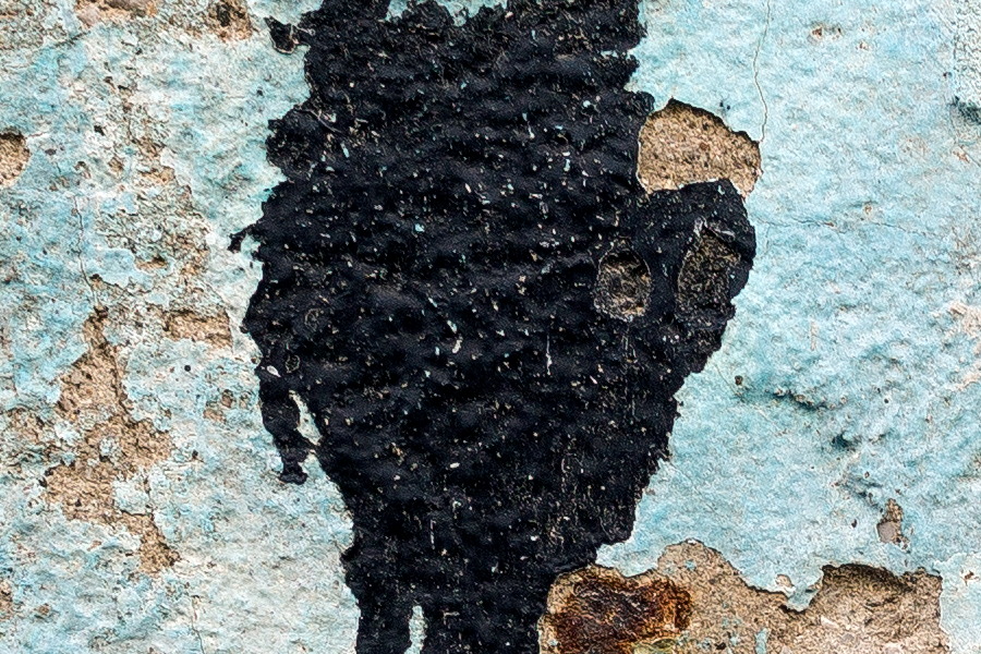 Photo 24614: Decayed, plastered brick wall in light blue, light brown and black