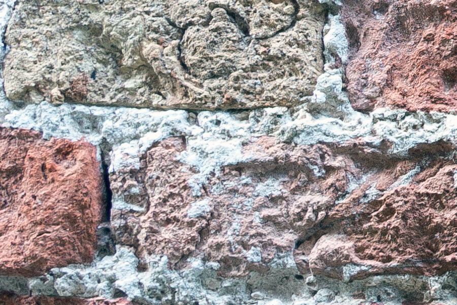 Photo 24790: Worn brick wall in red and yellow colours