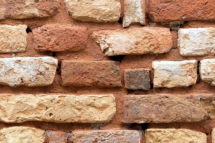 Photo 24865: Decayed brick wall in red, yellow, white and grey colours