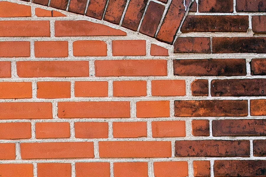 Photo 25093: Red brick wall with remains of a doorway.